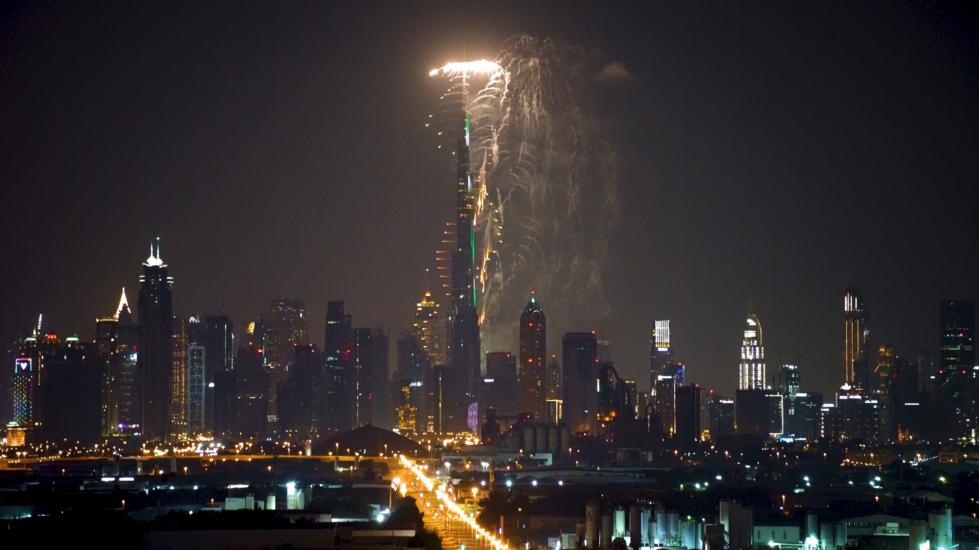 Fireworks over Dubai's skyline, featuring the illuminated Burj Khalifa.